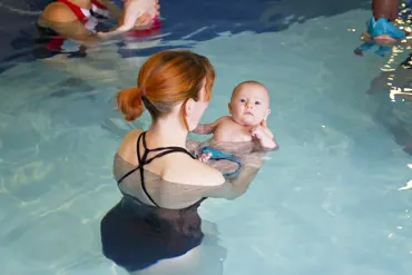 cute floatie looking up with mum